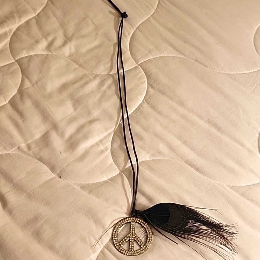 Beautiful rhinestone peace necklace with feathers